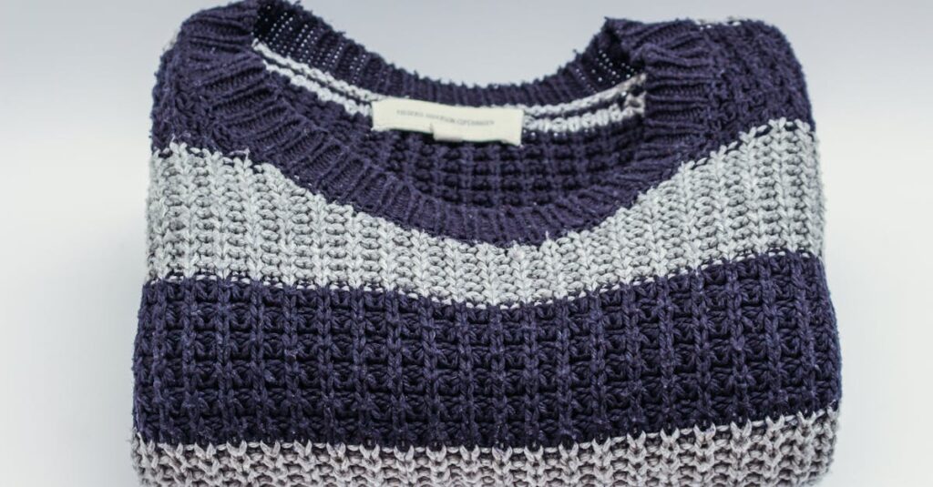 Warm knitted sweater with blue and white stripes, perfect for winter fashion.